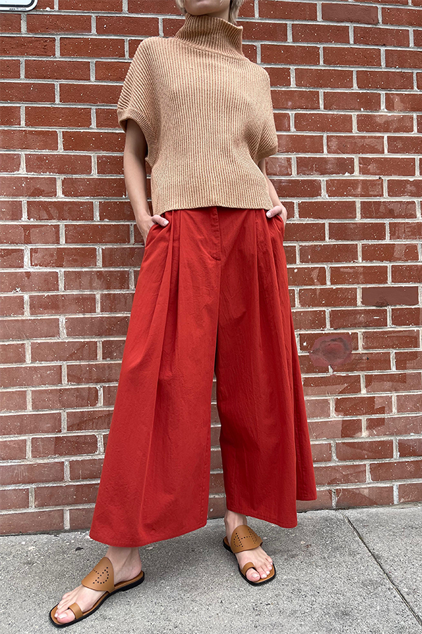 Terracotta Red. Cotton Samurai pants.  Wide pleated pants. Dusan. Dusan Samurai pants. Front button/sip closure Dusan Pants. Slitted Side pockets.  Red Dusan. Terracotta Dusan. Wide leg pants Dusan. Dusan Des Kohan. Des Kohan Los Angeles. Dusan West Hollywood. Des Kohan exclusive. Exclusive Terracotta Samurai Dusan Pants.