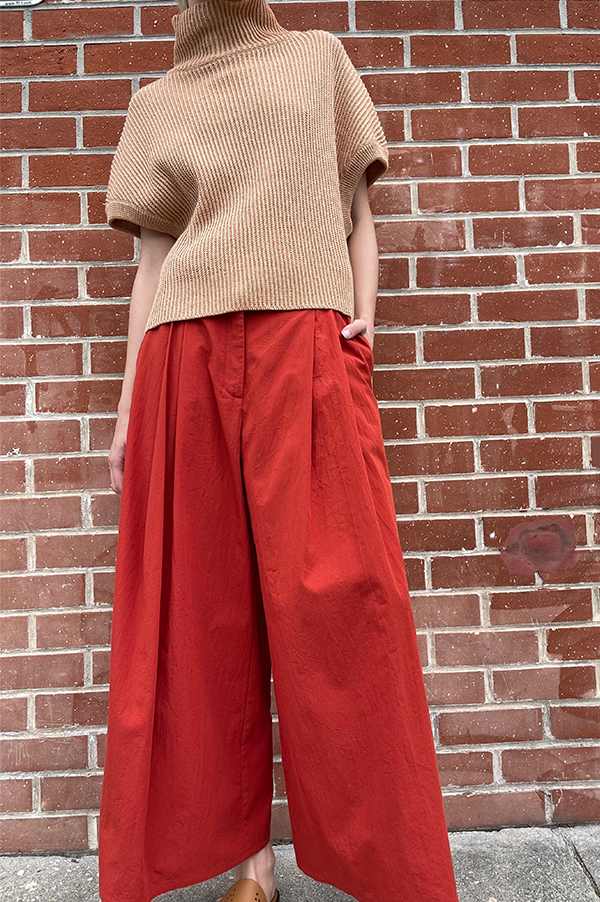 Terracotta Red. Cotton Samurai pants.  Wide pleated pants. Dusan. Dusan Samurai pants. Front button/sip closure Dusan Pants. Slitted Side pockets.  Red Dusan. Terracotta Dusan. Wide leg pants Dusan. Dusan Des Kohan. Des Kohan Los Angeles. Dusan West Hollywood. Des Kohan exclusive. Exclusive Terracotta Samurai Dusan Pants.