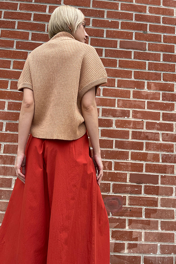 Terracotta Red. Cotton Samurai pants.  Wide pleated pants. Dusan. Dusan Samurai pants. Front button/sip closure Dusan Pants. Slitted Side pockets.  Red Dusan. Terracotta Dusan. Wide leg pants Dusan. Dusan Des Kohan. Des Kohan Los Angeles. Dusan West Hollywood. Des Kohan exclusive. Exclusive Terracotta Samurai Dusan Pants.