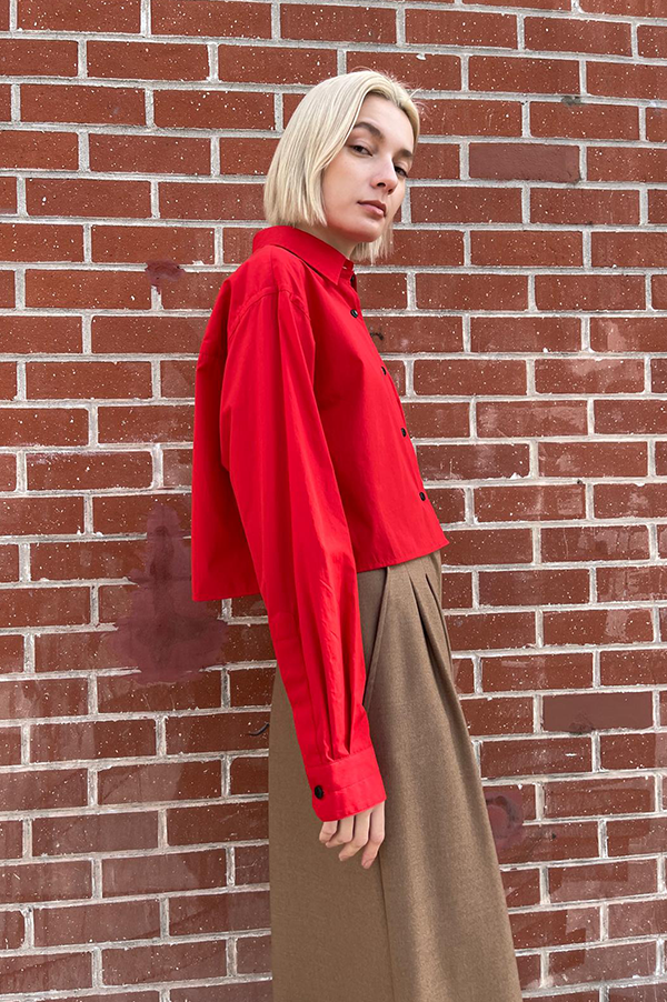 Lightweight Italian cotton shirt vibrant apple red. cropped shirt apple red. singular back box pleat hang loop. Maria McManus Crimson Red Waist-length shirt. McManus Scarlet Red Waist-length shirt. Maria McManus Cropped shirt Apple Red. Maria McManus Biodegradable buttons. Maria McManus Relaxed easy fit Apple Red shirt. Maria McManus Relaxed easy fit Scarlet Red shirt. Cropped button down shirt Apple red. Maria McManus button down shirt Apple Red. Maria McManus button down shirt scarlet. Crimson Red Shirt. 