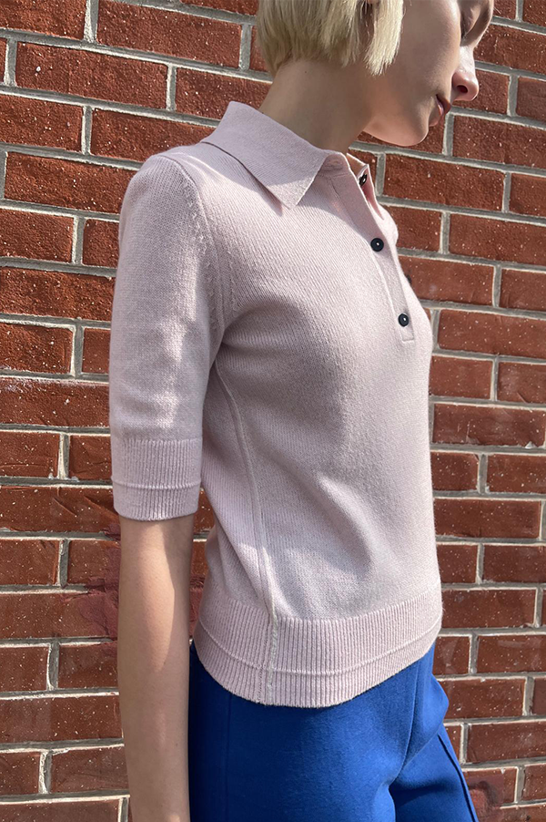 Featherweight Polo Sweater. Featherweight Sweater in Whisper Pink.  Recycled cashmere sweater. Organic cotton blend sweater. Whisper Pink knit. Maria McManus Featherweight Polo Sweater. Whisper Pink. Maria McManus Cashmere Sweater. Maria McManus Recycled Cashmere Sweater. Short Sleeve Polo Sweater in Blush. Short Sleeve Polo Sweater Whisper Pink.Recycled cashmere sweater.Organic cotton sweater Blush knit sweater.Whisper Pink. McManus Light Pink. McManus classic fit sweater.Classic fit sweater Whisper Pink