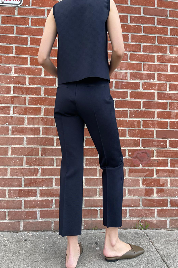 High Sport Asa Top. Navy Blue. Midnight Blue. Dark Blue. Subtle Jacquard. Crew Neck. Cropped.  NSFW Not Suitable For Work. Shiny Italian Viscose Knit French Lycra. Pullover style. Generous fit. Waist length. Rib trim neck. Rib trim armholes. Chic. Business. Versatile. Stylish. Pair with High Sport Kick Pant. Rich. Excellent fit. Day to Night Kick Pleat. Exceptional quality. Timeless. Made in Italy. Designed in Los Angeles. Premier fashion. Curated Des Kohan Boutique. Fairfax.  High- end. Fashion forward. 