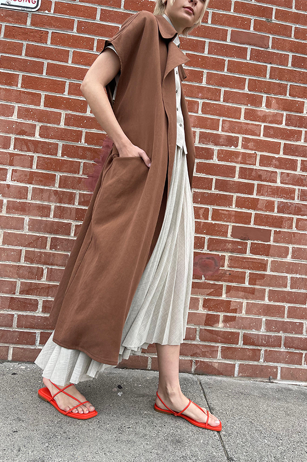 Terracotta. Dusan Terracotta. Dusan Heavy satin relaxed fit trench coat w/ tie. Dusan slash pockets at hips, high slit in the back, raw edges around armholes. Dusan sleeveless trench coat. Dusan Sleeveless Trench terracotta. Dusan sleeveless trench rich chocolate. Dusan Los Angeles. Dusan Des Kohan. Dusan Des Kohan Exclusive Trench Coat. Des Kohan West Hollywood. Dusan West Hollywood. 