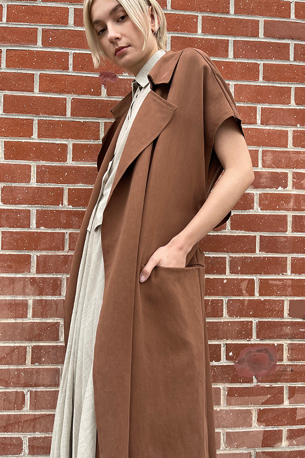 Terracotta. Dusan Terracotta. Dusan Heavy satin relaxed fit trench coat w/ tie. Dusan slash pockets at hips, high slit in the back, raw edges around armholes. Dusan sleeveless trench coat. Dusan Sleeveless Trench terracotta. Dusan sleeveless trench rich chocolate. Dusan Los Angeles. Dusan Des Kohan. Dusan Des Kohan Exclusive Trench Coat. Des Kohan West Hollywood. Dusan West Hollywood. 