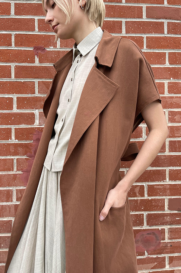 Terracotta. Dusan Terracotta. Dusan Heavy satin relaxed fit trench coat w/ tie. Dusan slash pockets at hips, high slit in the back, raw edges around armholes. Dusan sleeveless trench coat. Dusan Sleeveless Trench terracotta. Dusan sleeveless trench rich chocolate. Dusan Los Angeles. Dusan Des Kohan. Dusan Des Kohan Exclusive Trench Coat. Des Kohan West Hollywood. Dusan West Hollywood. 