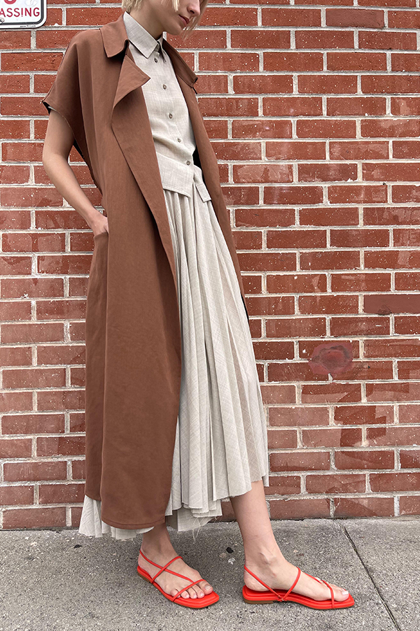Terracotta. Dusan Terracotta. Dusan Heavy satin relaxed fit trench coat w/ tie. Dusan slash pockets at hips, high slit in the back, raw edges around armholes. Dusan sleeveless trench coat. Dusan Sleeveless Trench terracotta. Dusan sleeveless trench rich chocolate. Dusan Los Angeles. Dusan Des Kohan. Dusan Des Kohan Exclusive Trench Coat. Des Kohan West Hollywood. Dusan West Hollywood. 